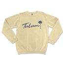 a white sweatshirt with the word tulum written in blue ink
