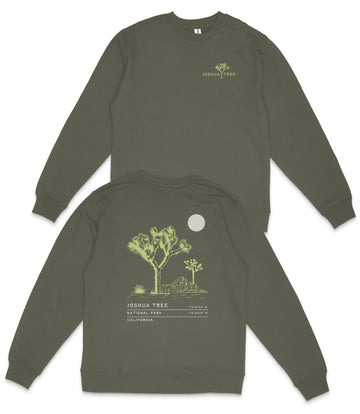 a grey sweatshirt with a graphic design on the back, depicting a tree and a moon.