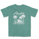 a green shirt with an image of a wave and palm trees