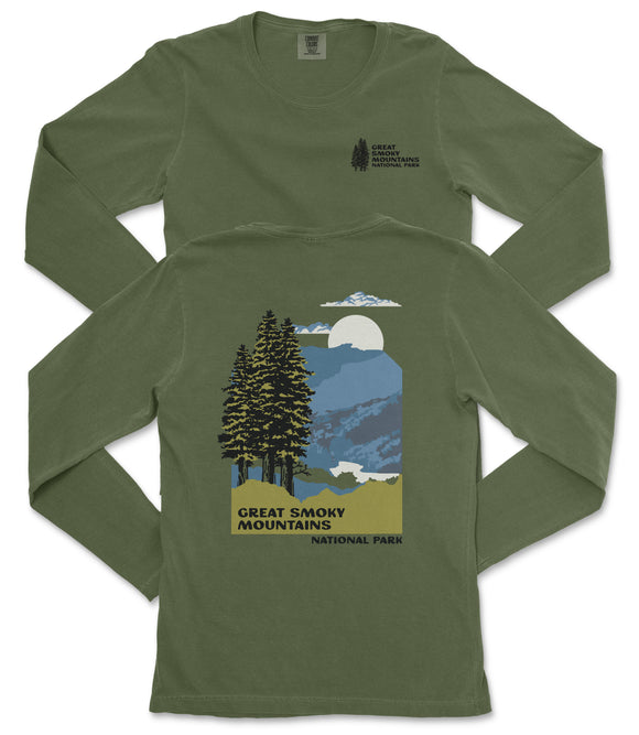 A green long-sleeved t-shirt with a graphic design depicting a mountain landscape with pine trees, a full moon, and clouds. The text on the t-shirt reads "GREAT SMOKY MOUNTAINS NATIONAL PARK".