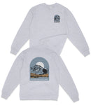 A gray sweatshirt with a graphic design depicting a mountain landscape and the text "Glacier National Park" printed on the back.