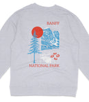 A gray sweatshirt with a graphic design featuring a mountain range, a pine tree, a moose, and flowers, along with the text "BANFF NATIONAL PARK".