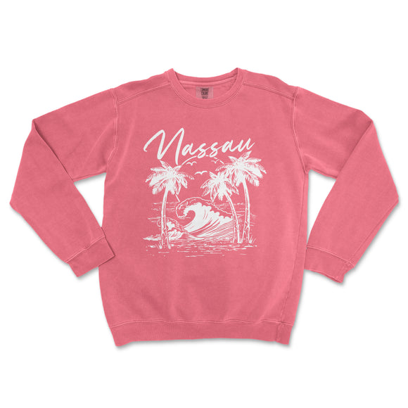 a pink sweatshirt with a picture of a wave and palm trees