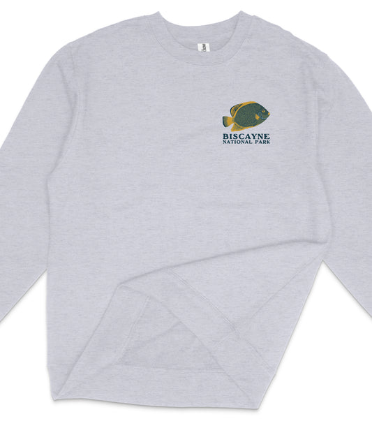 A gray sweatshirt with a graphic of a fish and the text "BISCAYNE NATIONAL PARK" printed on it.