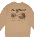 a beige sweater with a graphic design depicting a bear and a landscape with a volcano in the background.
