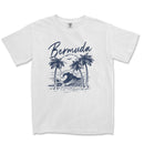 a white t - shirt with a picture of a wave and palm trees