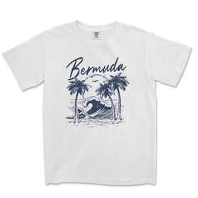 a white t - shirt with a picture of a wave and palm trees