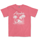 a pink shirt with an image of a wave and palm trees