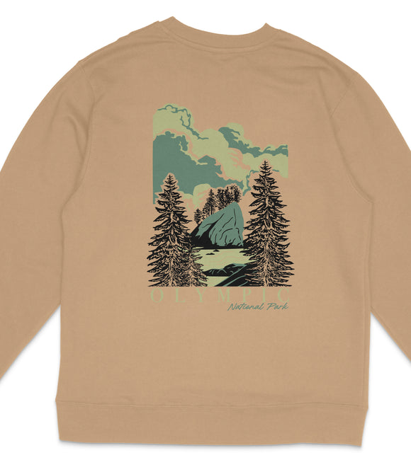 A beige sweatshirt with a graphic design depicting a mountain landscape with pine trees and a lake.