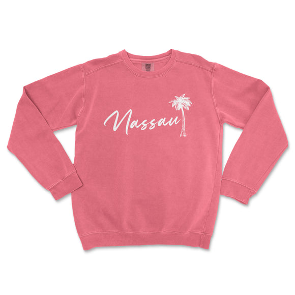 a pink sweatshirt with a palm tree on it