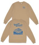 a tan sweatshirt with a blue design on the back, depicting a mountain landscape with a lake and trees.