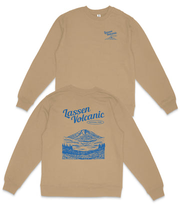 a tan sweatshirt with a blue design on the back, depicting a mountain landscape with a lake and trees.