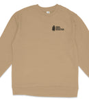 A tan long-sleeved shirt with a small black logo on the left side.