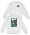 A white long-sleeved sweatshirt with a graphic design on the back featuring a mountain landscape and the text "YOSEMITE" printed on it.