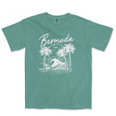 a t - shirt with a picture of a wave and palm trees