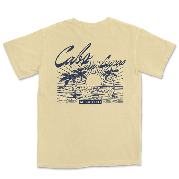 a t - shirt with a picture of a sunset and palm trees