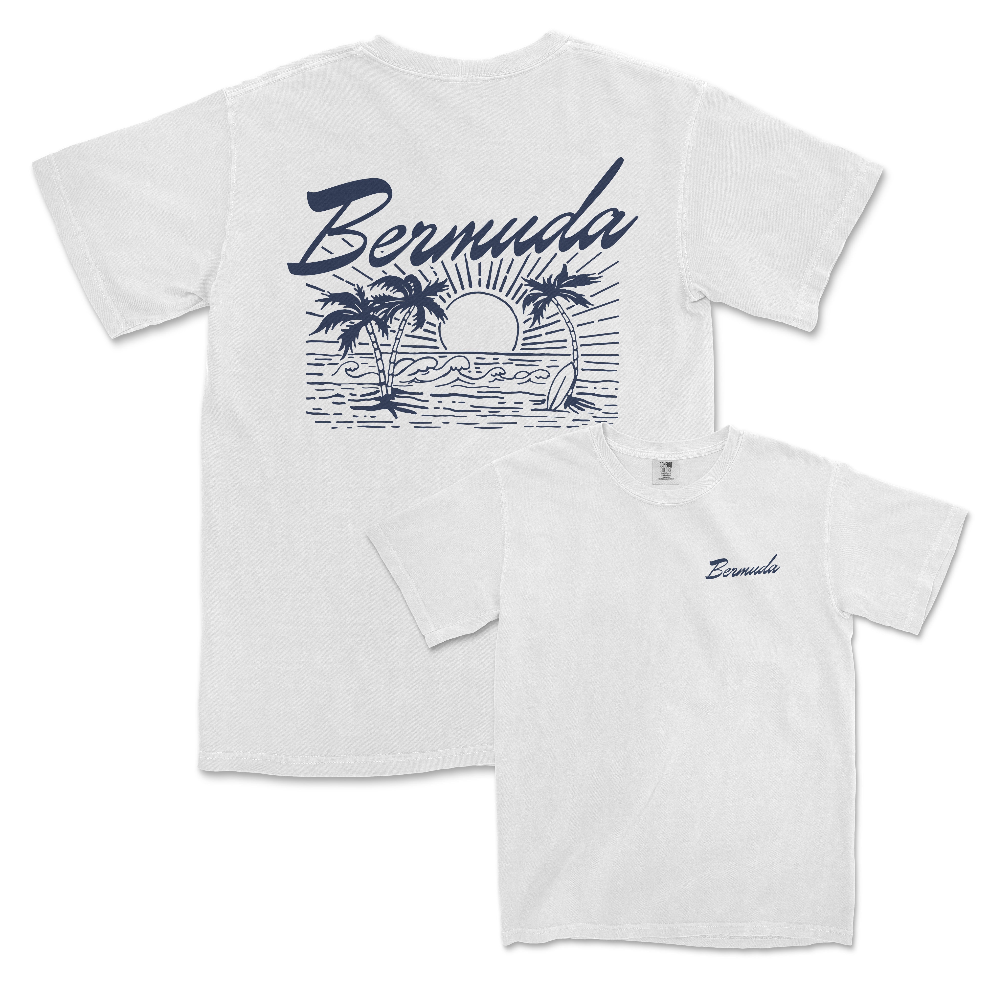 a white t - shirt with a picture of a sunset and palm trees