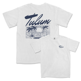 a white t - shirt with a surfboard in the background