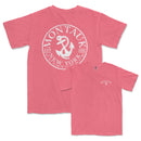 a pink shirt with an anchor on it