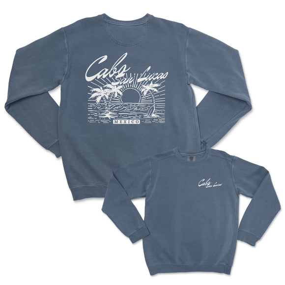 a blue sweatshirt with a picture of a boat and palm trees