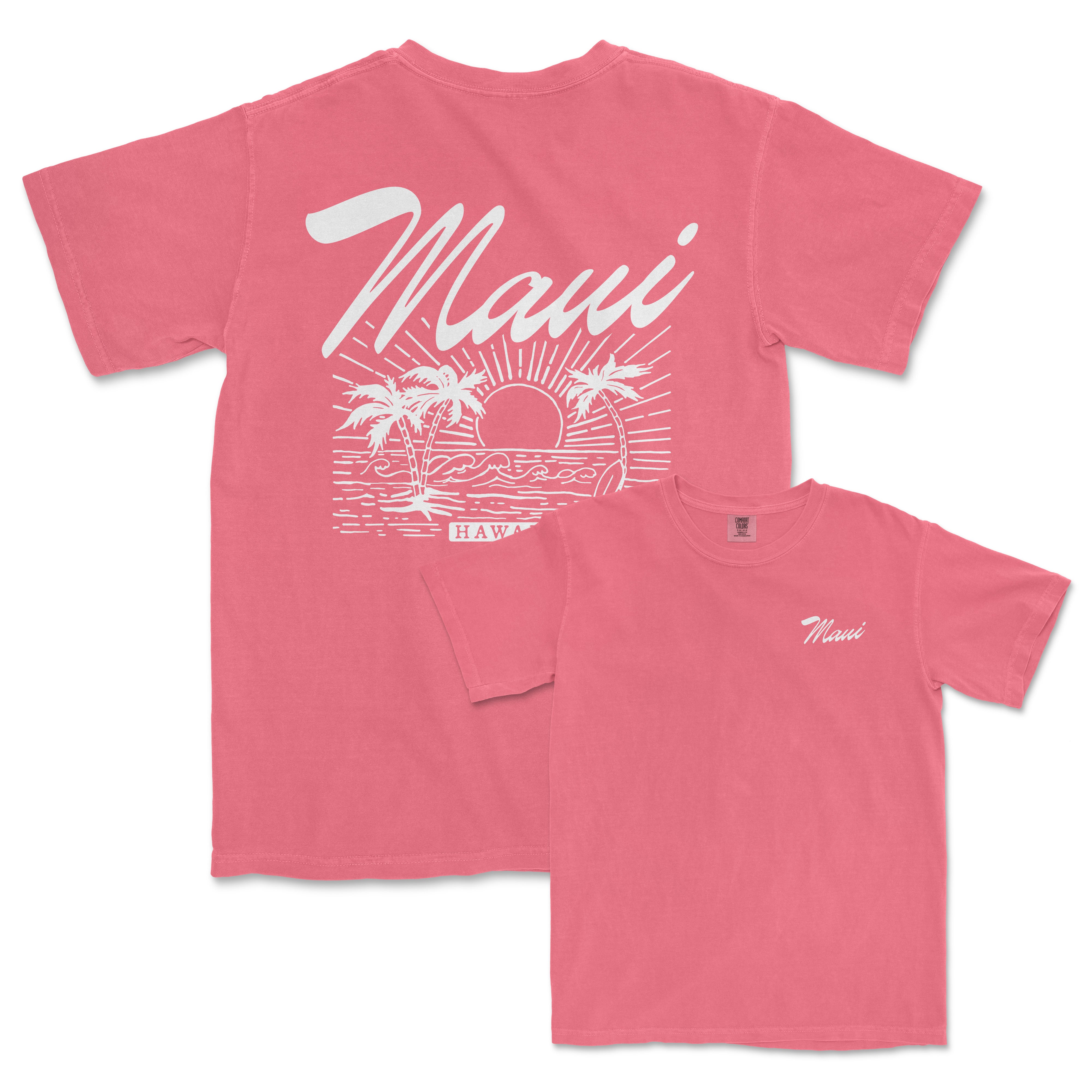 a pink t - shirt with a sunset and palm trees on it