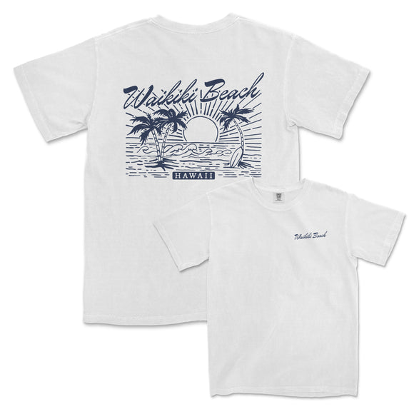 a white t - shirt with a sunset and palm trees on it