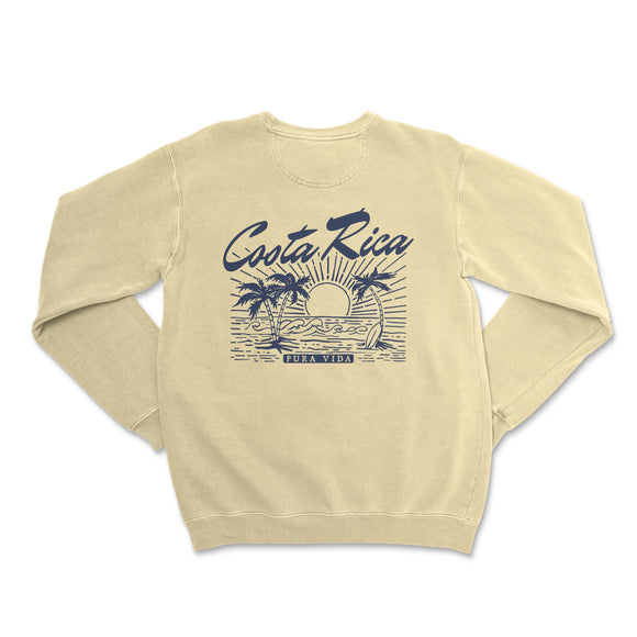a white sweatshirt with a blue graphic of a sunset and palm trees
