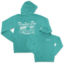 a turquoise sweatshirt with a palm tree on it