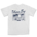 a white t - shirt with a blue and white image of a beach scene