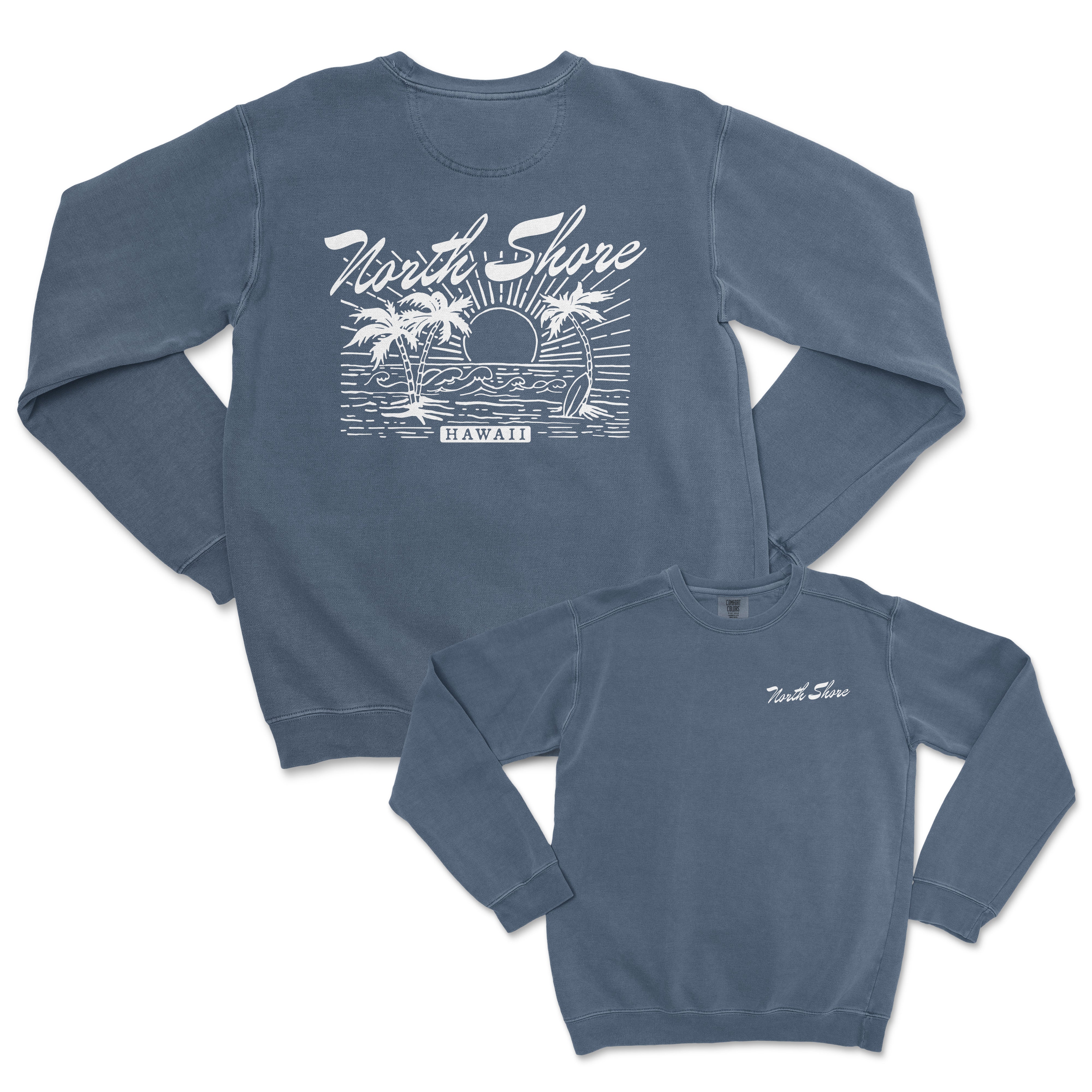 the back of a blue sweatshirt with an image of a sunset and palm trees