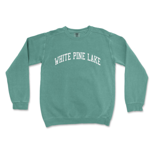 a green sweatshirt with white pine lake written on it