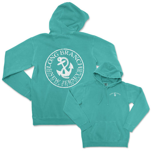 a green sweatshirt with a white anchor on it