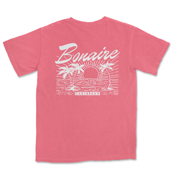 a pink t - shirt with a sunset and palm trees