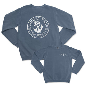 a blue sweatshirt with an anchor and a white seal on it