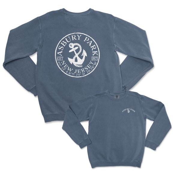 a blue sweatshirt with an anchor and a white seal on it