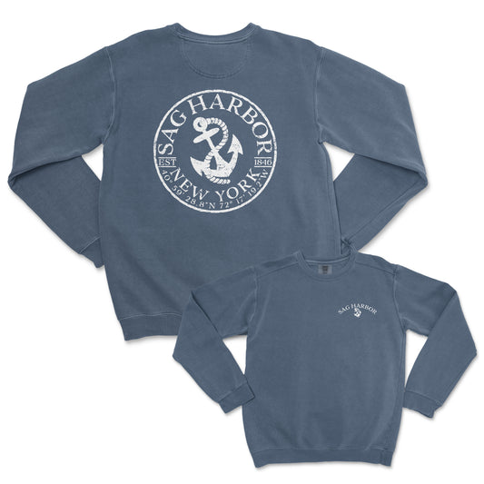 a blue sweatshirt with a white anchor on it