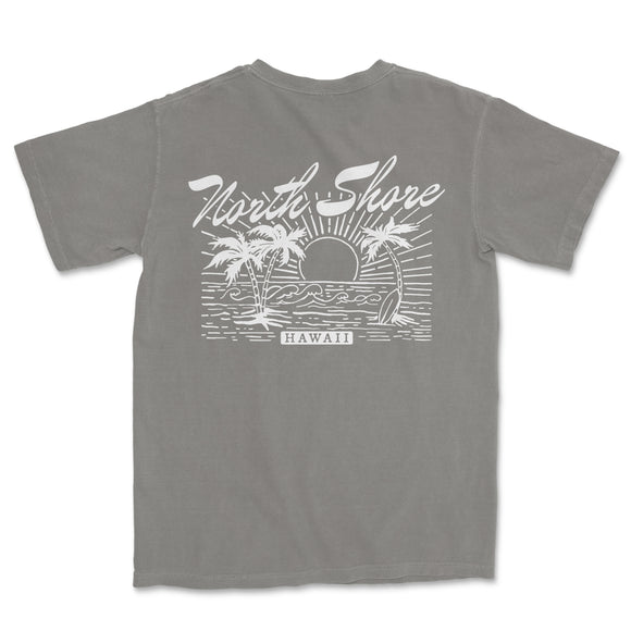 a gray t - shirt with a picture of a beach scene