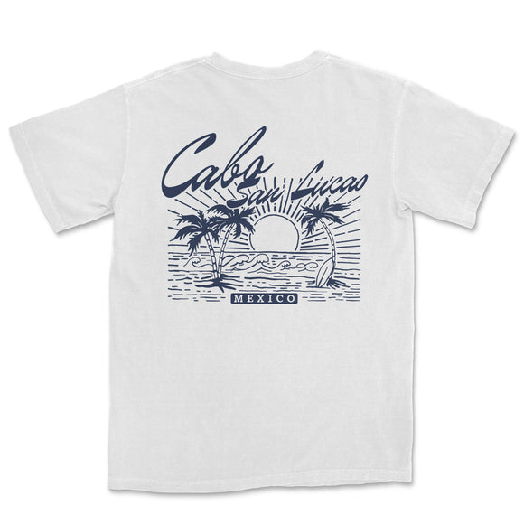 a white t - shirt with an image of a sunset and palm trees